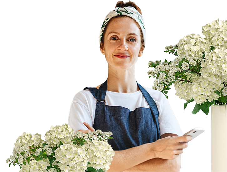 Flower shop owner standing in her establishment